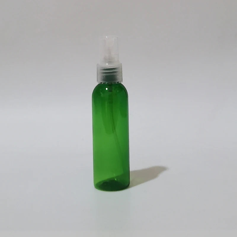 Green round spray bottle with clear sprayer and protective cap
