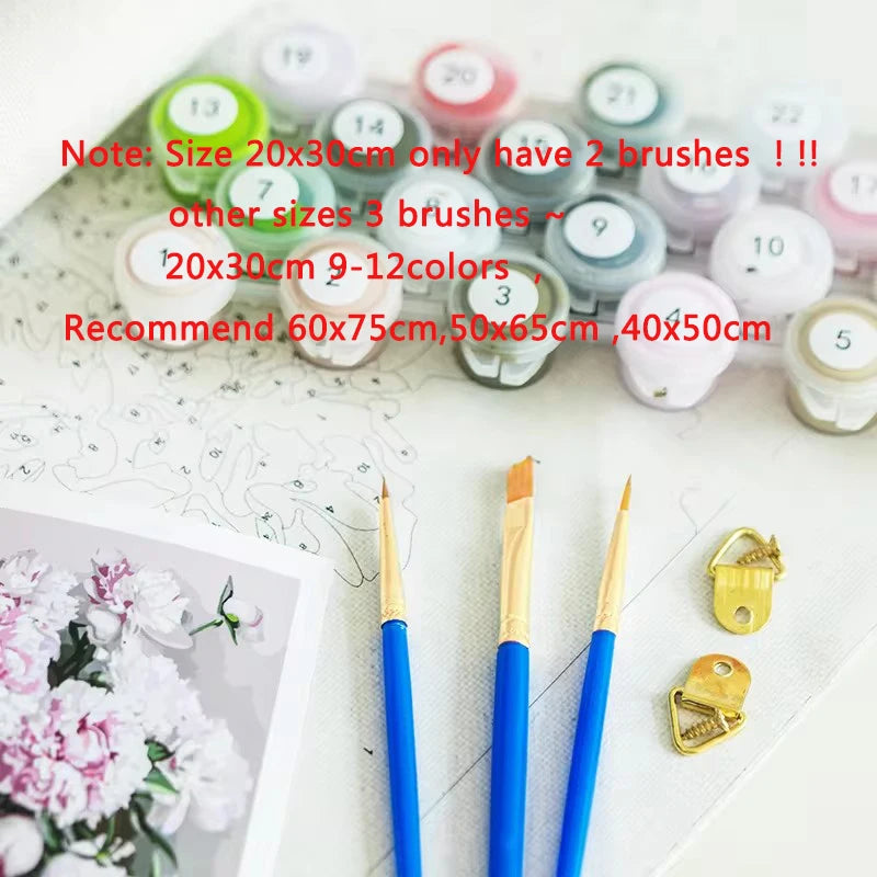 Set of paintbrushes with color swatches and floral design in the background