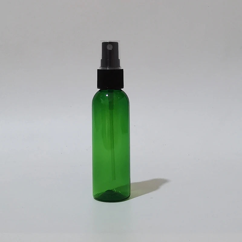 Green round spray bottle with black sprayer and clear protective cap