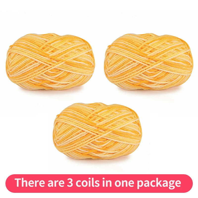 Three golden yellow tonal yarn skeins, shown as one package on a white background.