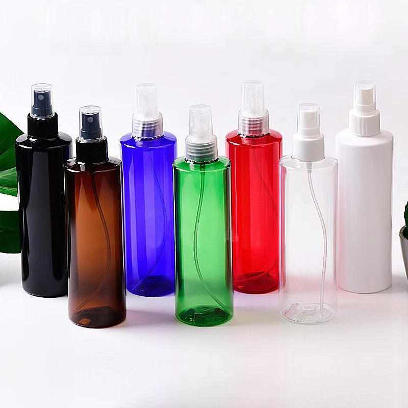 Black, brown, blue, green, red, clear and white empty bottles with spray closures