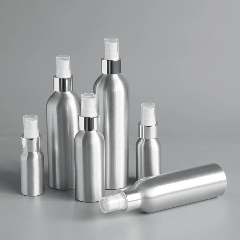 Silver aluminum spray bottles in six sizes with clear protective caps