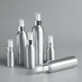 Silver aluminum spray bottles in six sizes with clear protective caps