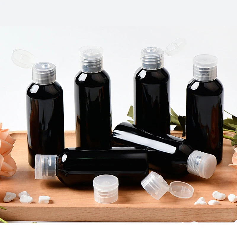 Black PET bottles with clear flip-top caps and spare closures