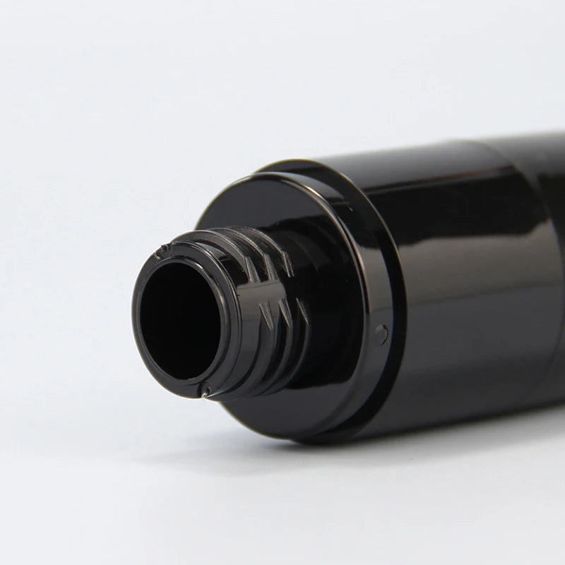 Close-up of the threaded neck and opening on a black spray bottle