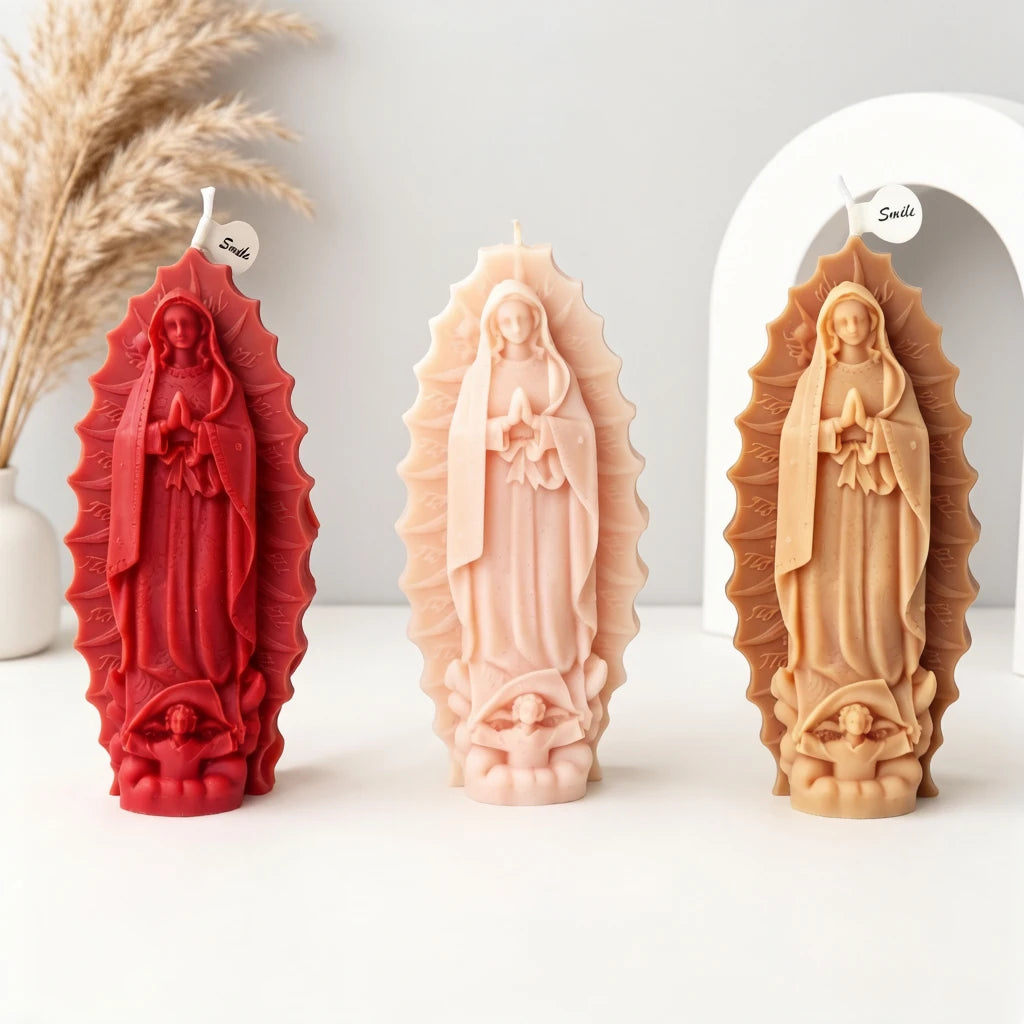 Red, pale pink and tan example praying Virgin Mary candles with flowing robes and decorative surrounds