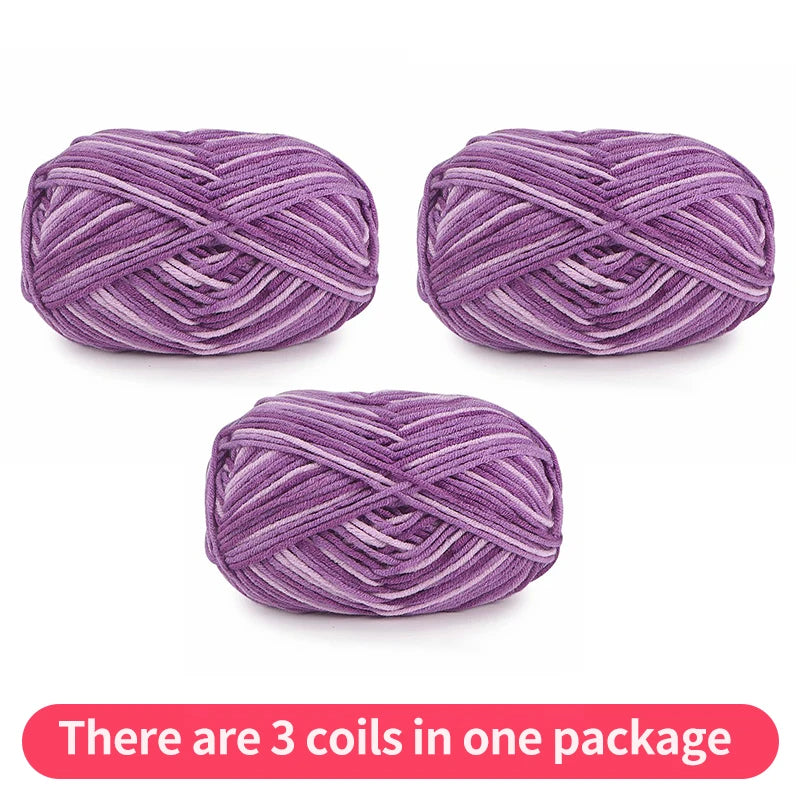 Three purple tonal yarn skeins, shown as one package on a white background.