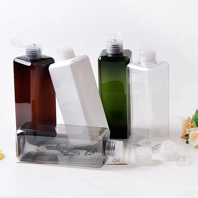 Square brown, white, green, clear and gray bottles with clear flip-top caps