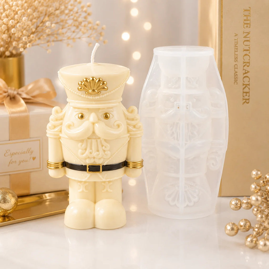 Wide-bodied ivory nutcracker soldier example candle beside its white silicone mold