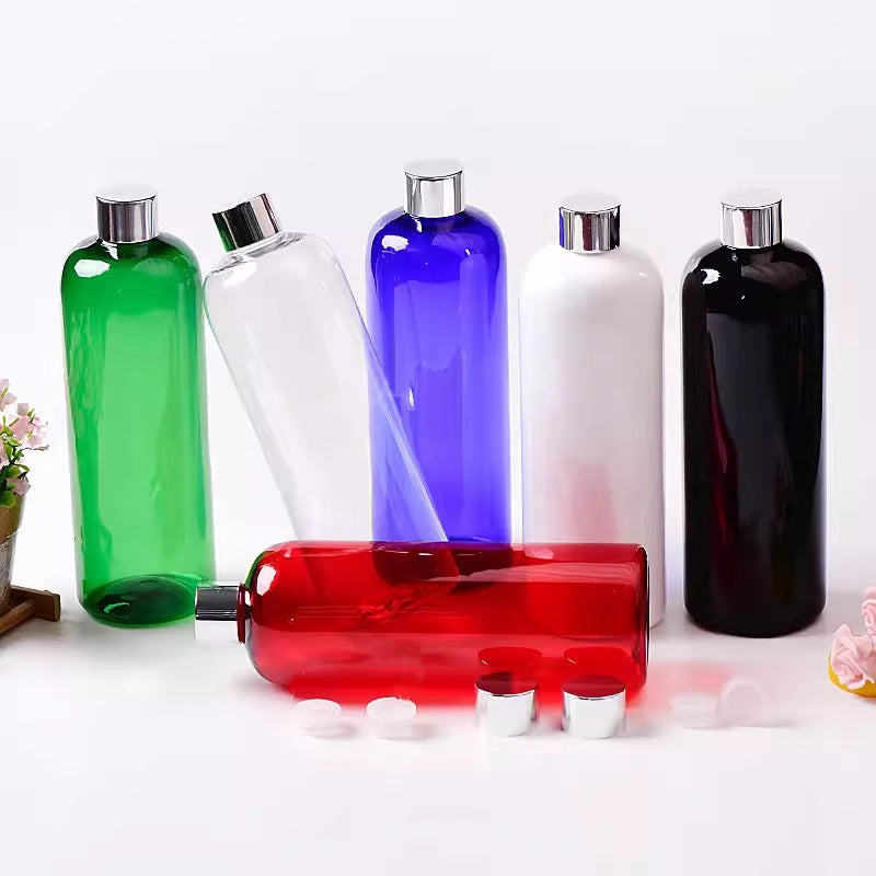 Green, clear, blue, white, black and red bottles with silver-tone screw caps