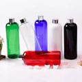 Green, clear, blue, white, black and red bottles with silver-tone screw caps