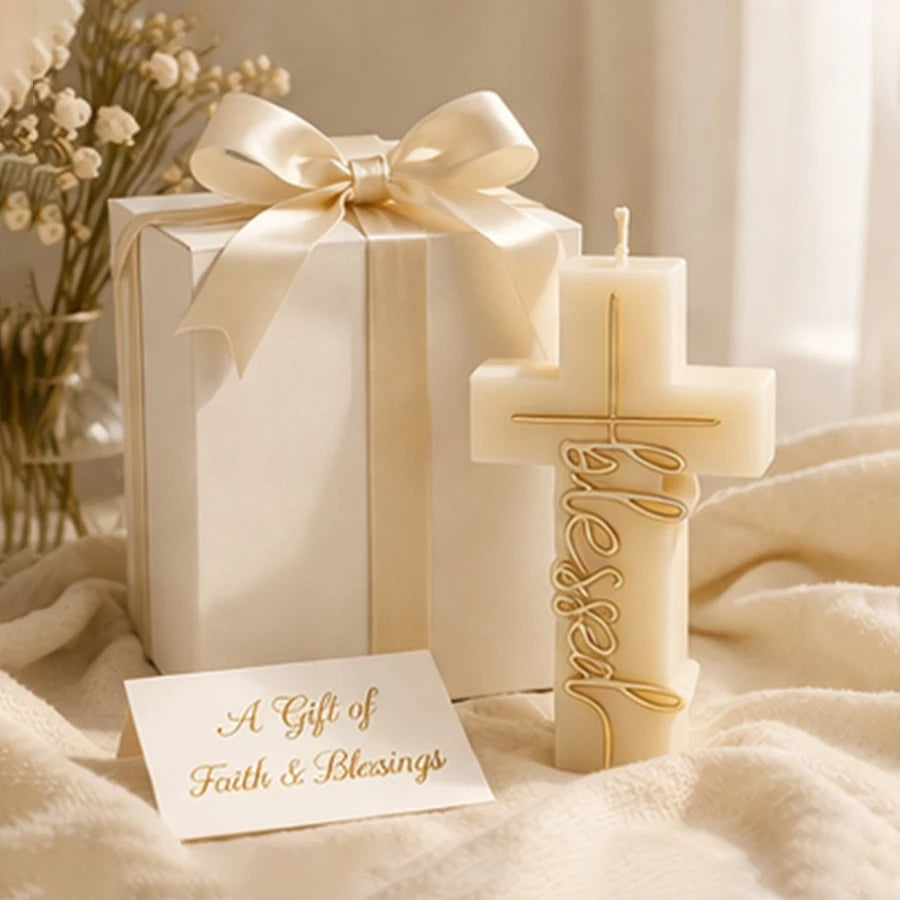 Blessed cross example candle beside a ribboned gift box and a faith-themed card