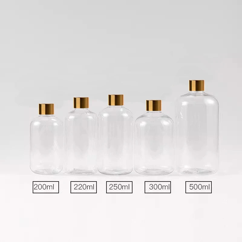 Clear PET bottles with gold-tone screw caps in a five-size group