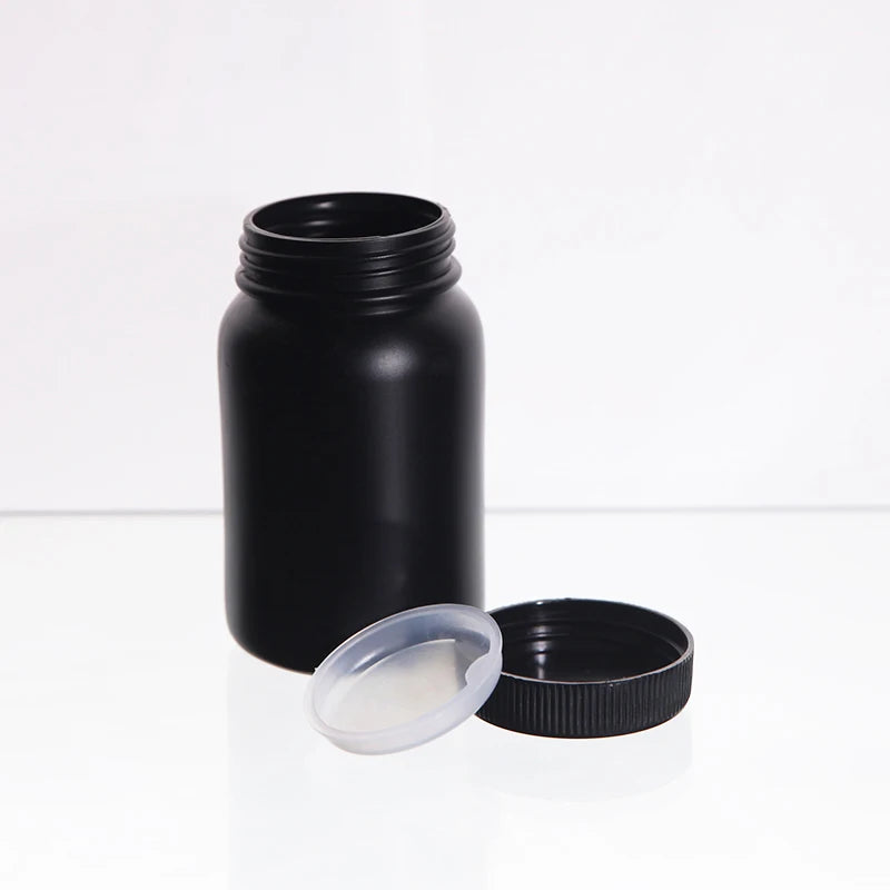 Open black wide-mouth bottle with separate inner insert and screw cap