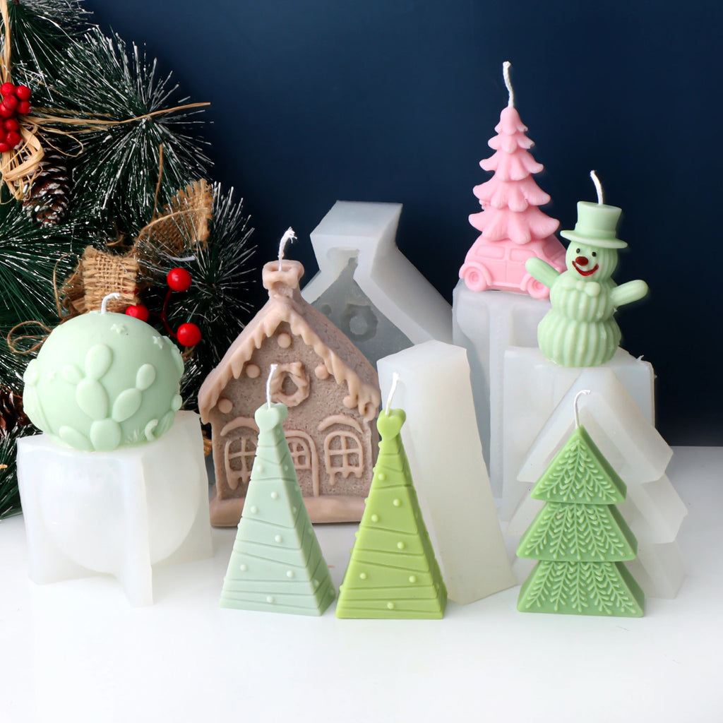 Seven Christmas example candles displayed with white silicone molds behind and beneath them