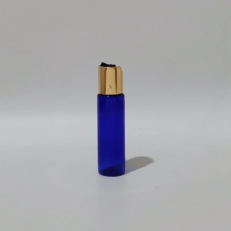 Blue PET bottle with gold-tone disc-top cap and black insert, blue-1
