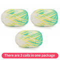Three variegated yarn skeins in turquoise, yellow and white, shown as one package.