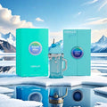 ARMAF Island Bliss insulated tumbler set with turquoise packaging boxes, shown on a snowy icy surface with mountain scenery in the background. The set includes a turquoise tumbler with a handle and straw, a matching box, and another turquoise box.