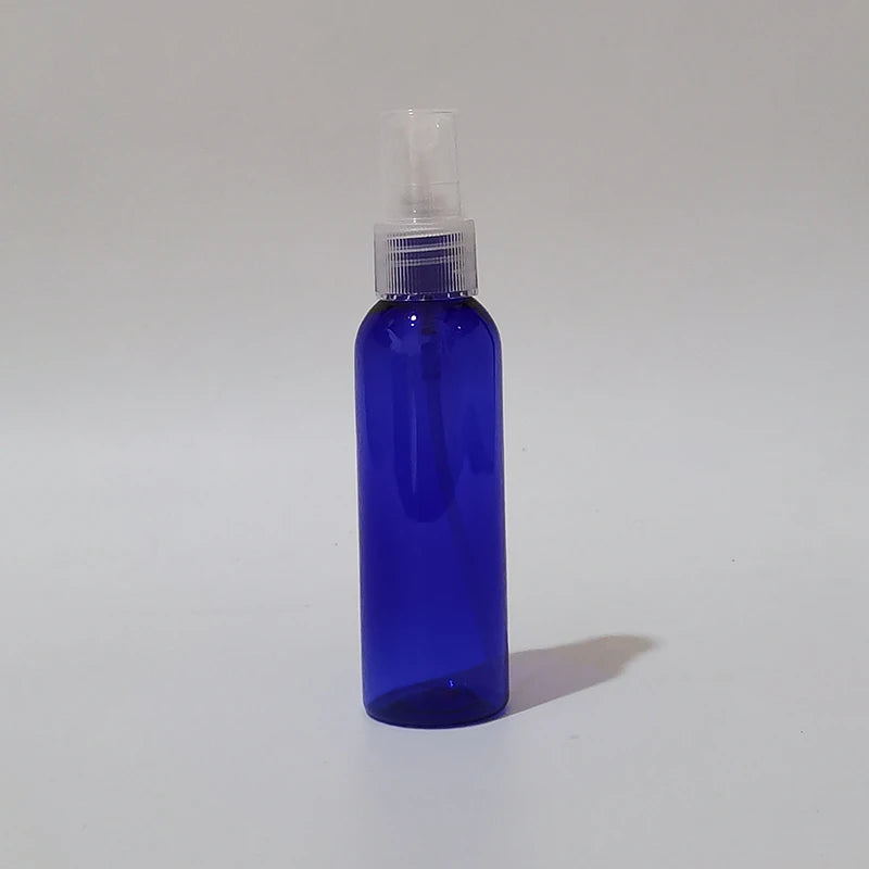 Blue round spray bottle with clear sprayer and protective cap