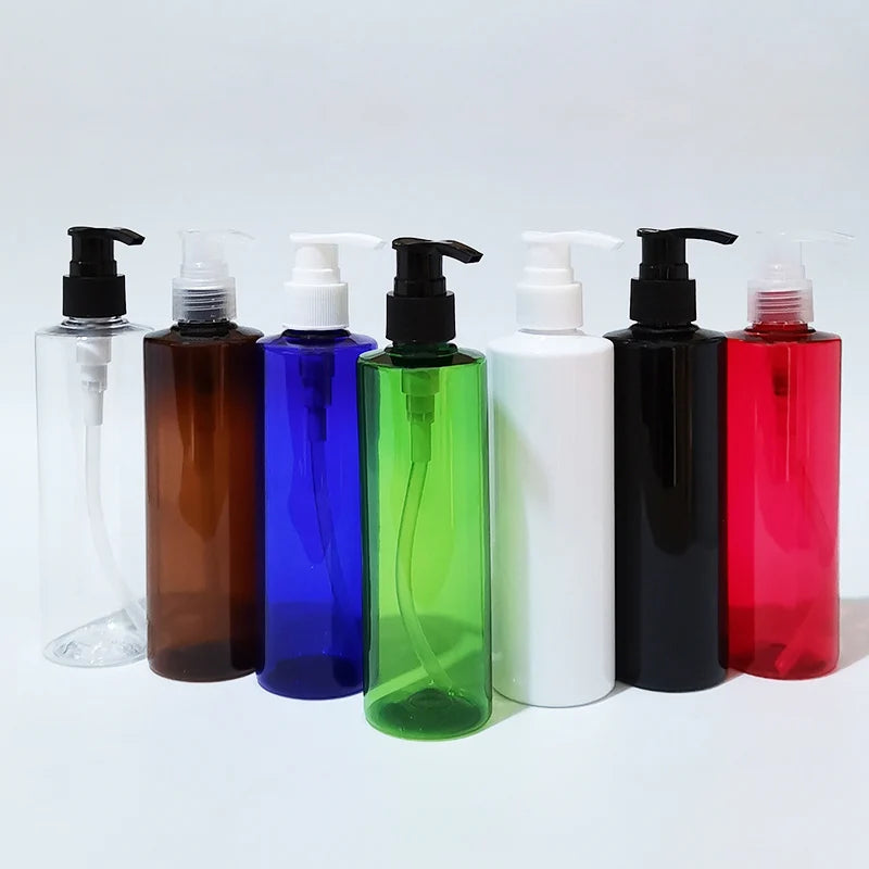 Colored round PET bottles with black, white and clear dispensing pumps