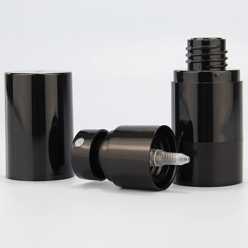 Black airless-style spray bottle disassembled to show cover, sprayer and threaded opening