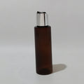 Brown empty bottle with a silver-tone disc cap and black insert