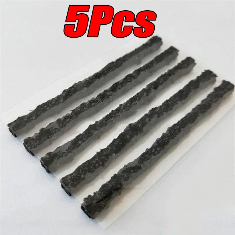 Five black tire plugs on a white background with '5PCS' in red text above.