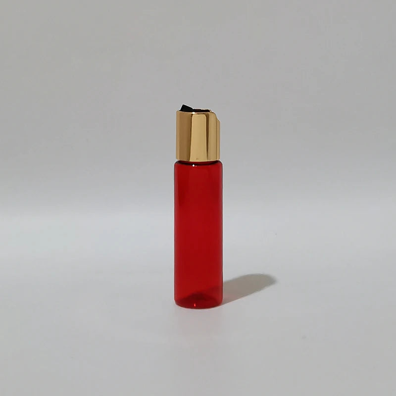 Red PET bottle with gold-tone disc-top cap and black insert, red-1