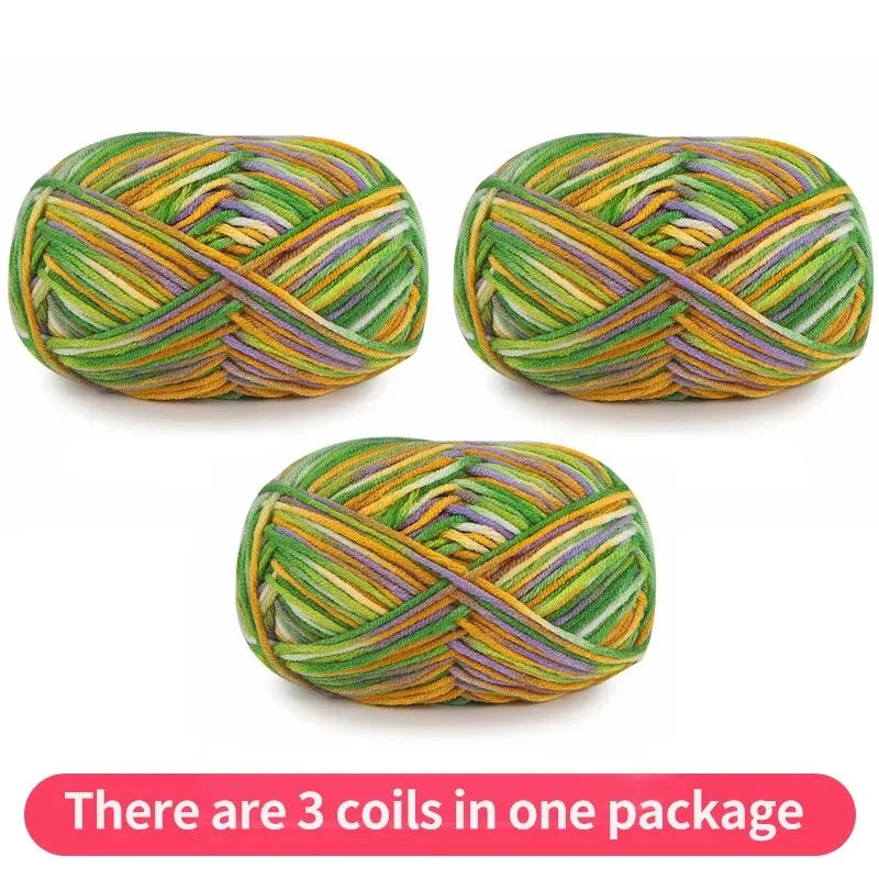 Three variegated yarn skeins in green, gold, purple and white, shown as one package.