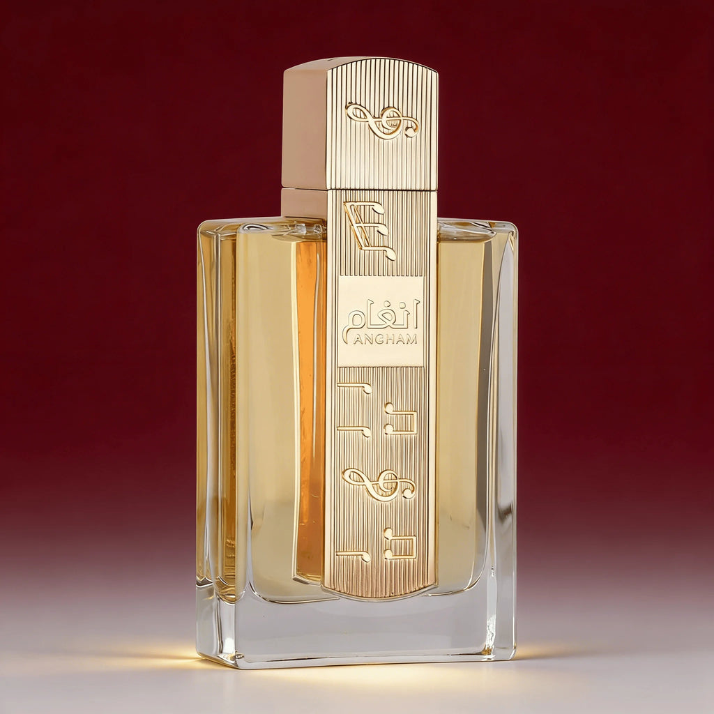 Angham Eesha fragrance bottle with a clear glass body, golden-yellow liquid, and a ribbed gold cap, centered against a dark red gradient background.