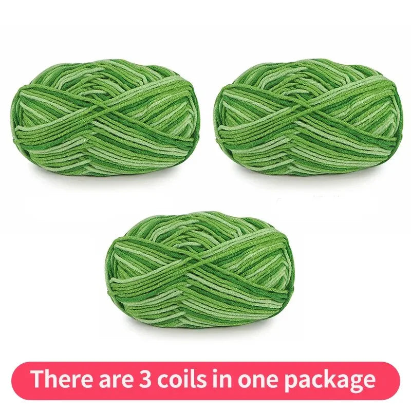 Three green tonal yarn skeins, shown as one package on a white background.