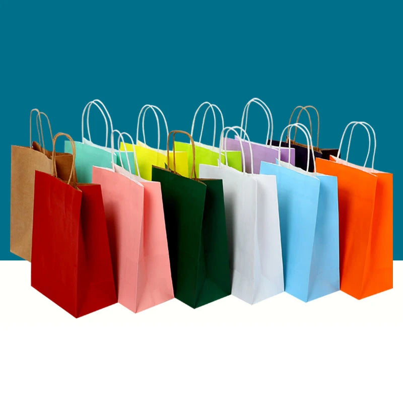 Colorful paper gift bags on a blue background