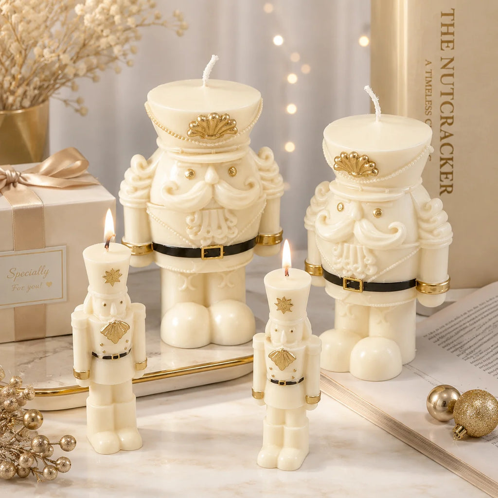 Two lit slender nutcracker example candles in front of two wide-bodied nutcracker examples