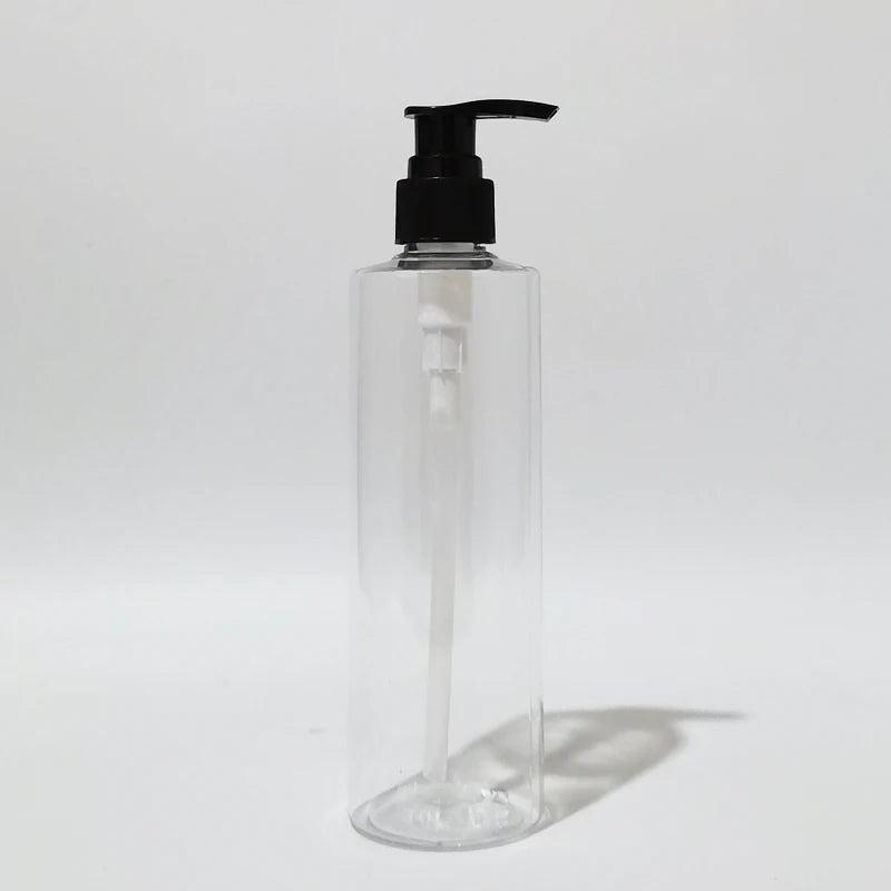 Clear round PET bottle with black lotion pump and visible dip tube
