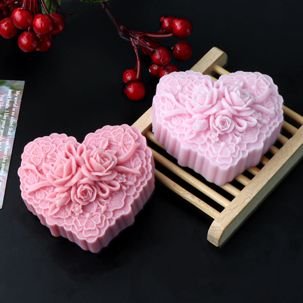 Two pink floral-heart soap casting examples with roses and lace-like detail