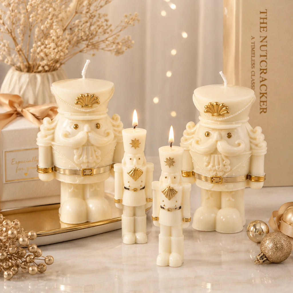 Ivory nutcracker example candles in front of a mirror, with the two slender soldiers lit