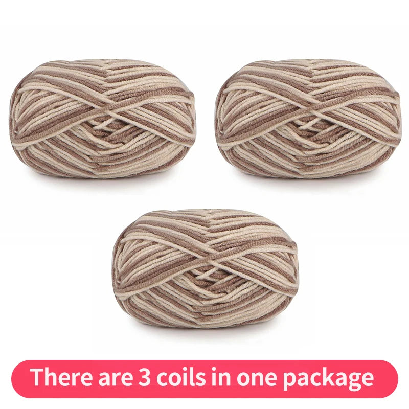 Three beige and taupe variegated yarn skeins, shown as one package.