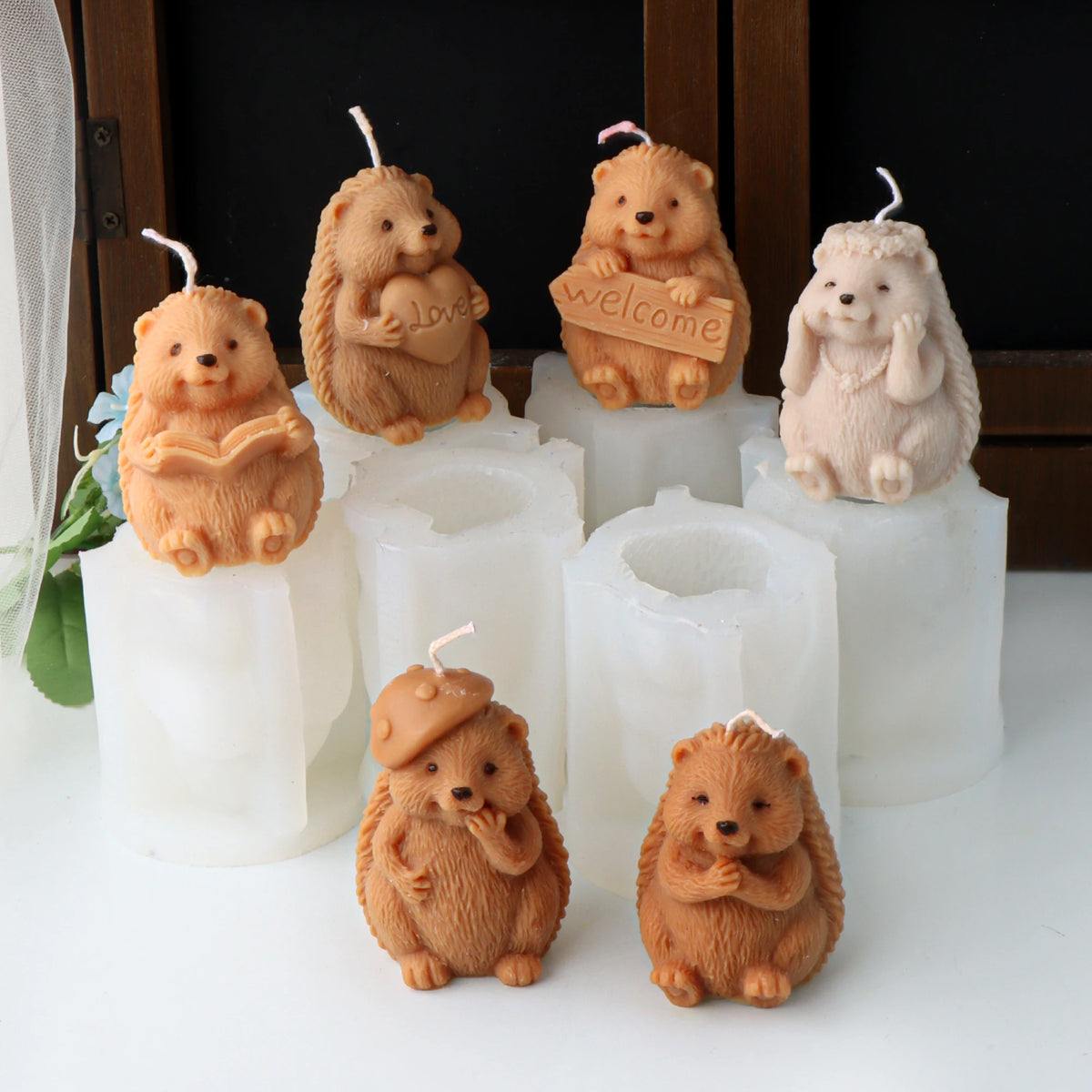 Six hedgehog example candles with book, Love heart, Welcome sign, flower crown and mushroom-cap details