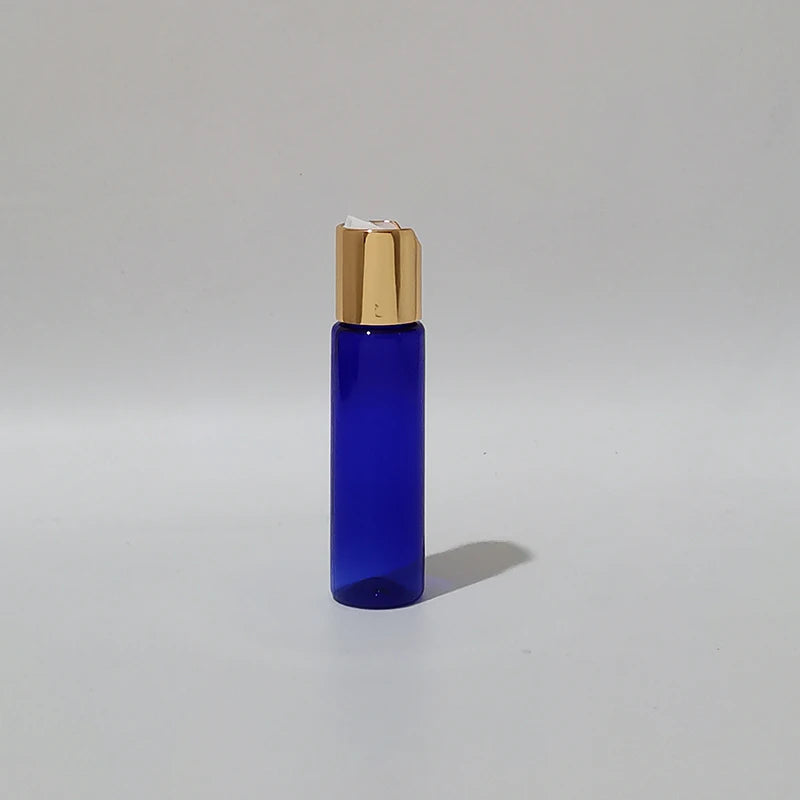 Blue PET bottle with gold-tone disc-top cap and white insert, blue-2