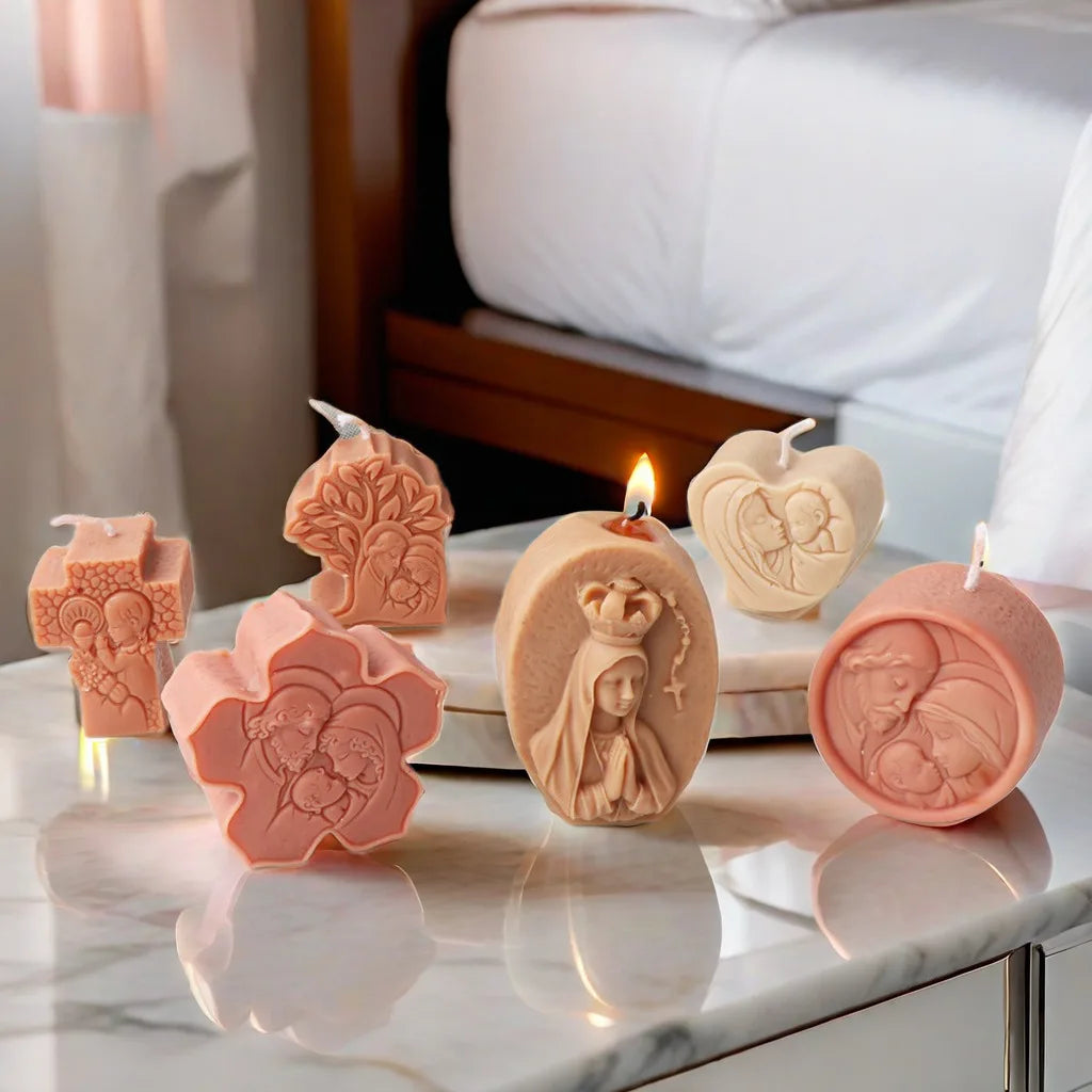 Six peach and ivory religious relief example candles in cross, tree, flower, oval, round and heart shapes