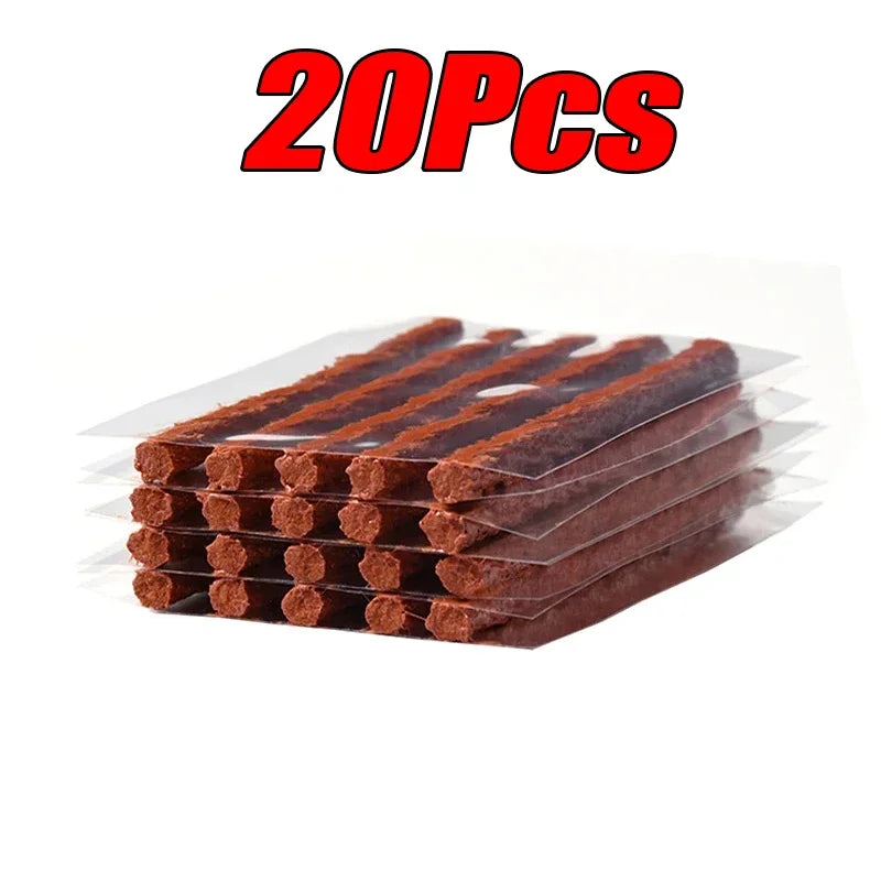 Pack of 20 brown tire plugs with clear plastic packaging on a white background.