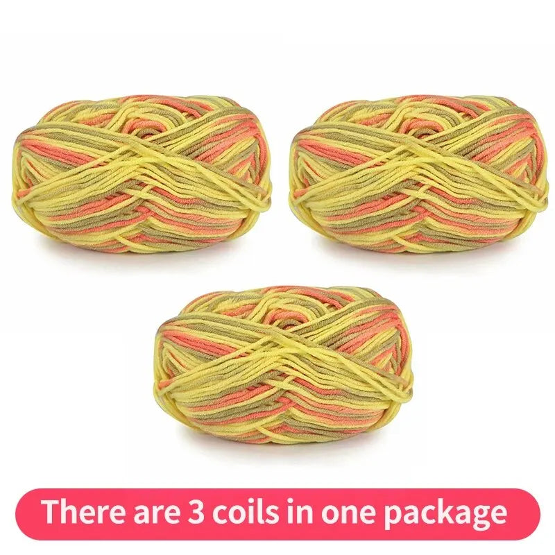 Three variegated yarn skeins in yellow-green, olive and coral, shown as one package.