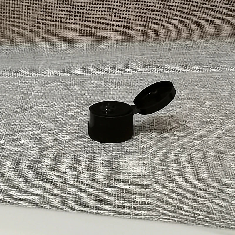 Single black flip-top bottle cap with hinged lid open