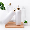 White and clear large PET bottles with white pumps and gold-tone collars