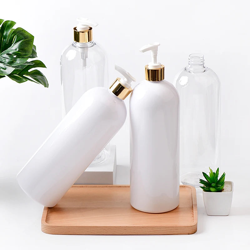 White and clear large PET bottles with white pumps and gold-tone collars