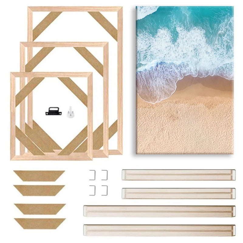 Set of wooden picture frames and a beach scene canvas on a white background