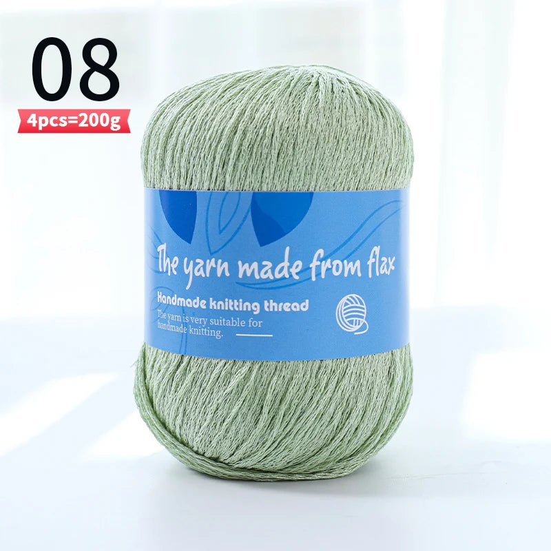 Pale sage green linen lace yarn skein, color code 08, with a blue flax label.