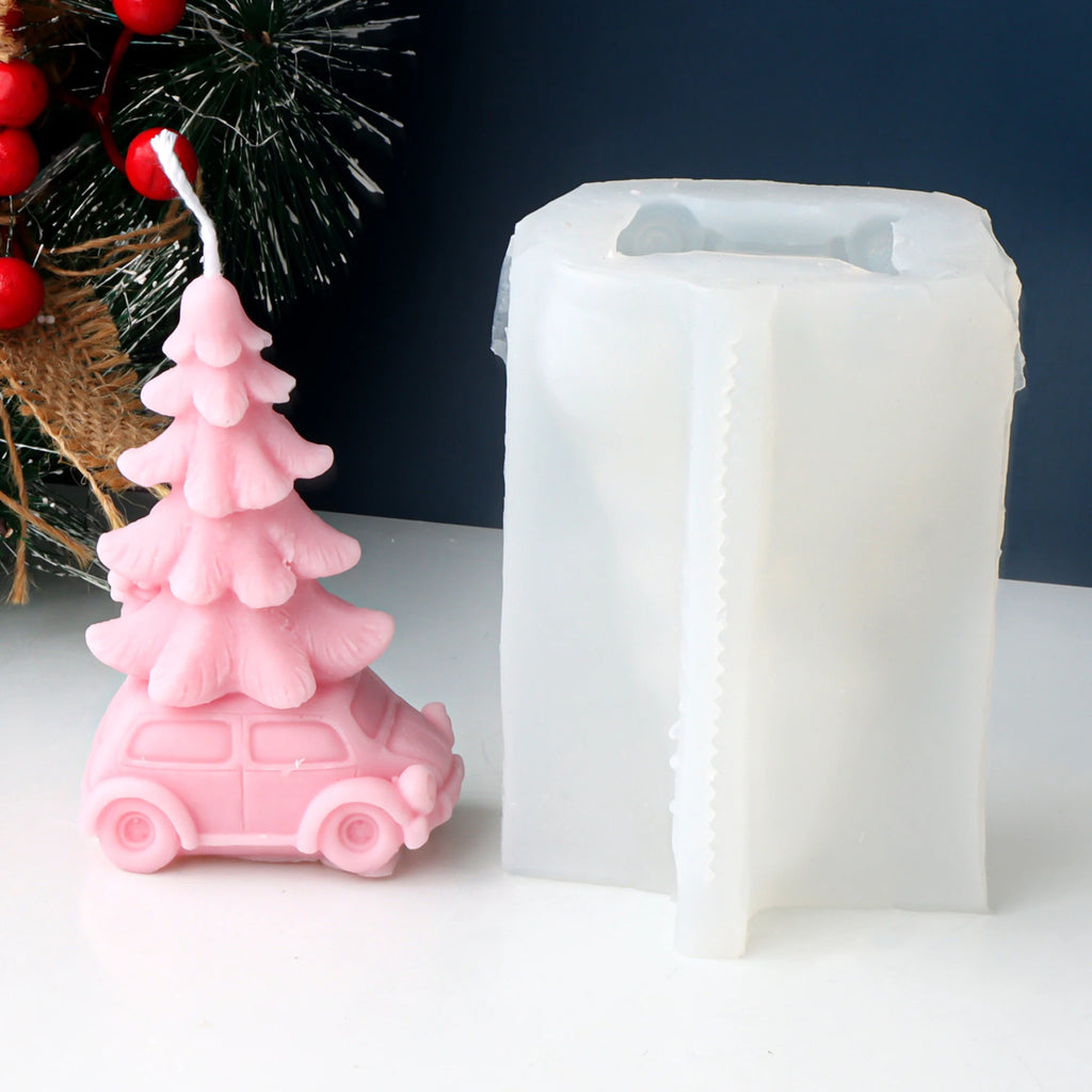 Pink car carrying a Christmas tree example candle beside its white silicone mold