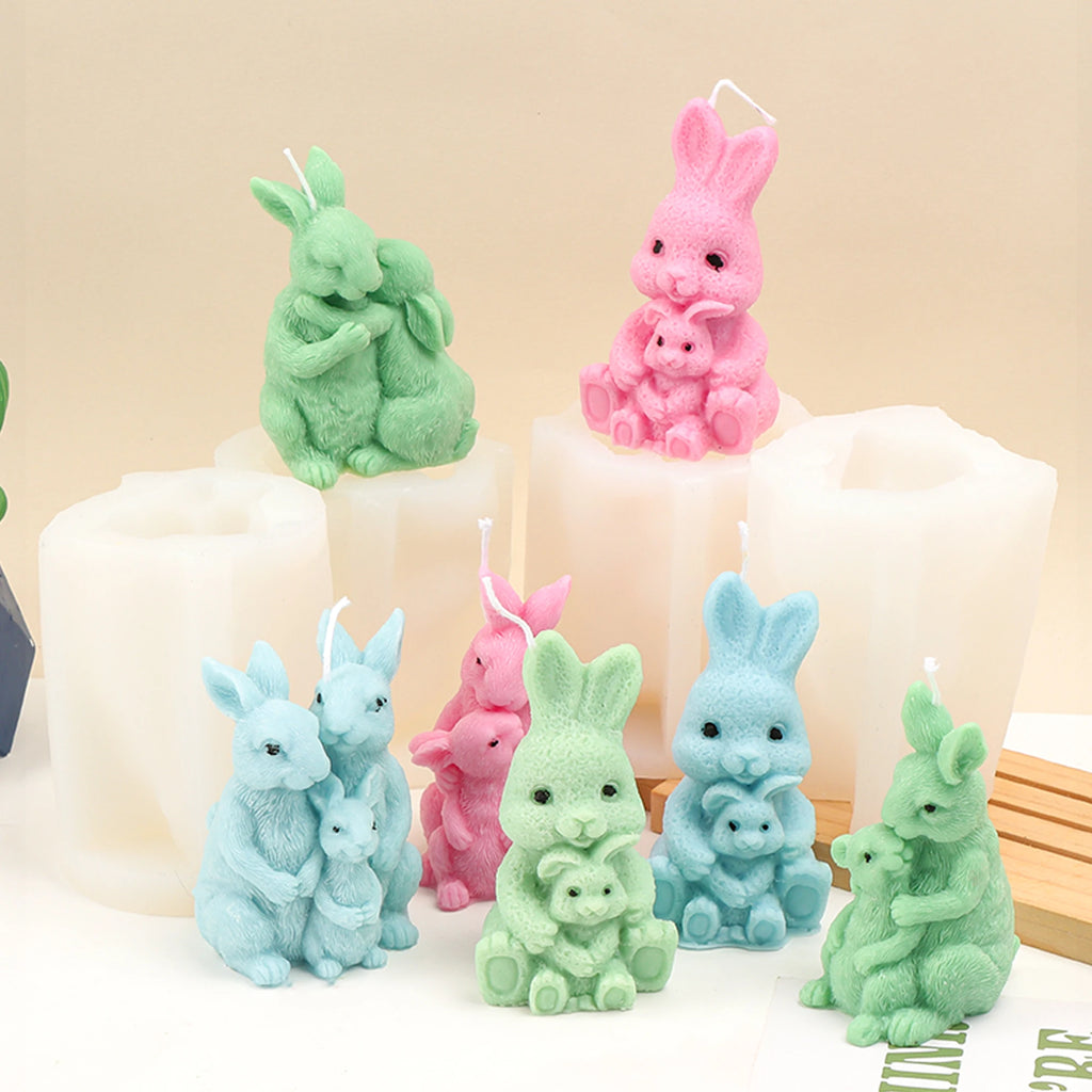 Pastel rabbit family casting examples displayed around their white silicone molds