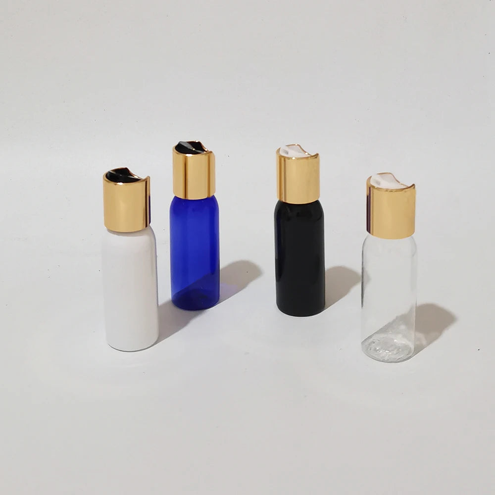 Four small PET disc-top bottles with gold-tone caps arranged separately